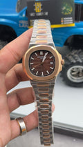 Rose gold two tone with chocolate Dial.