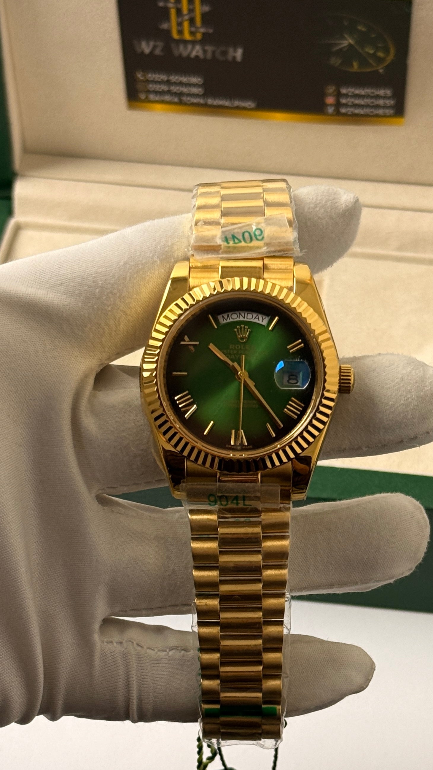 Yellow Gold with  Green Dial.