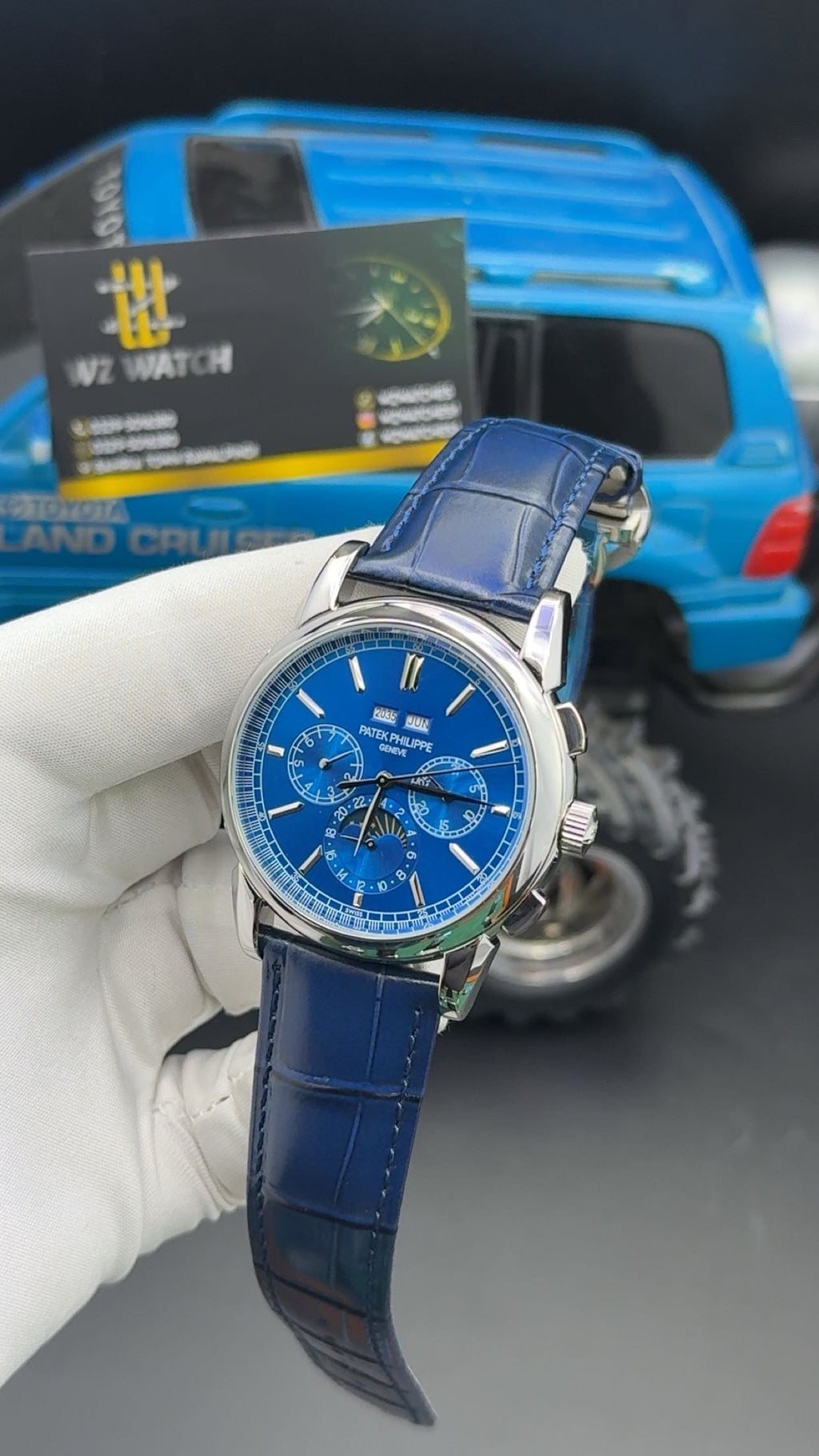 Silver with blue Dial.