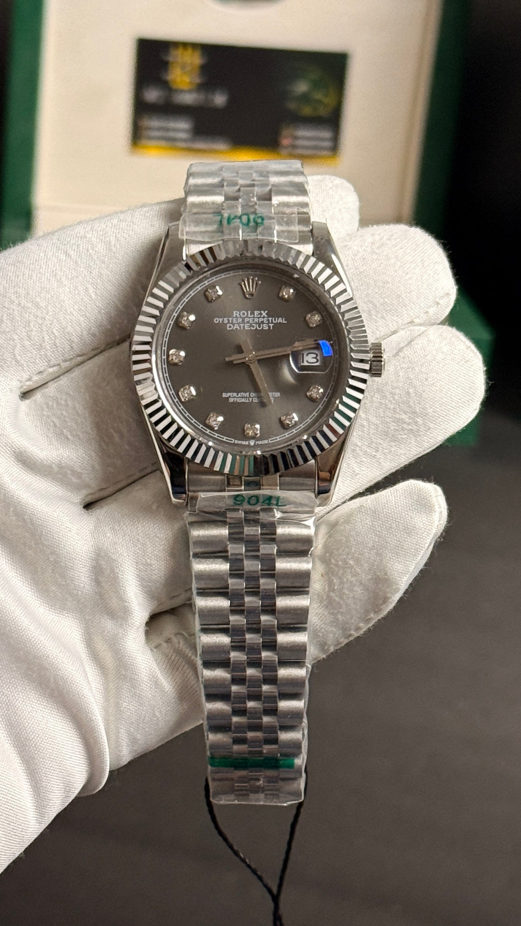 Silver with grey Dial.