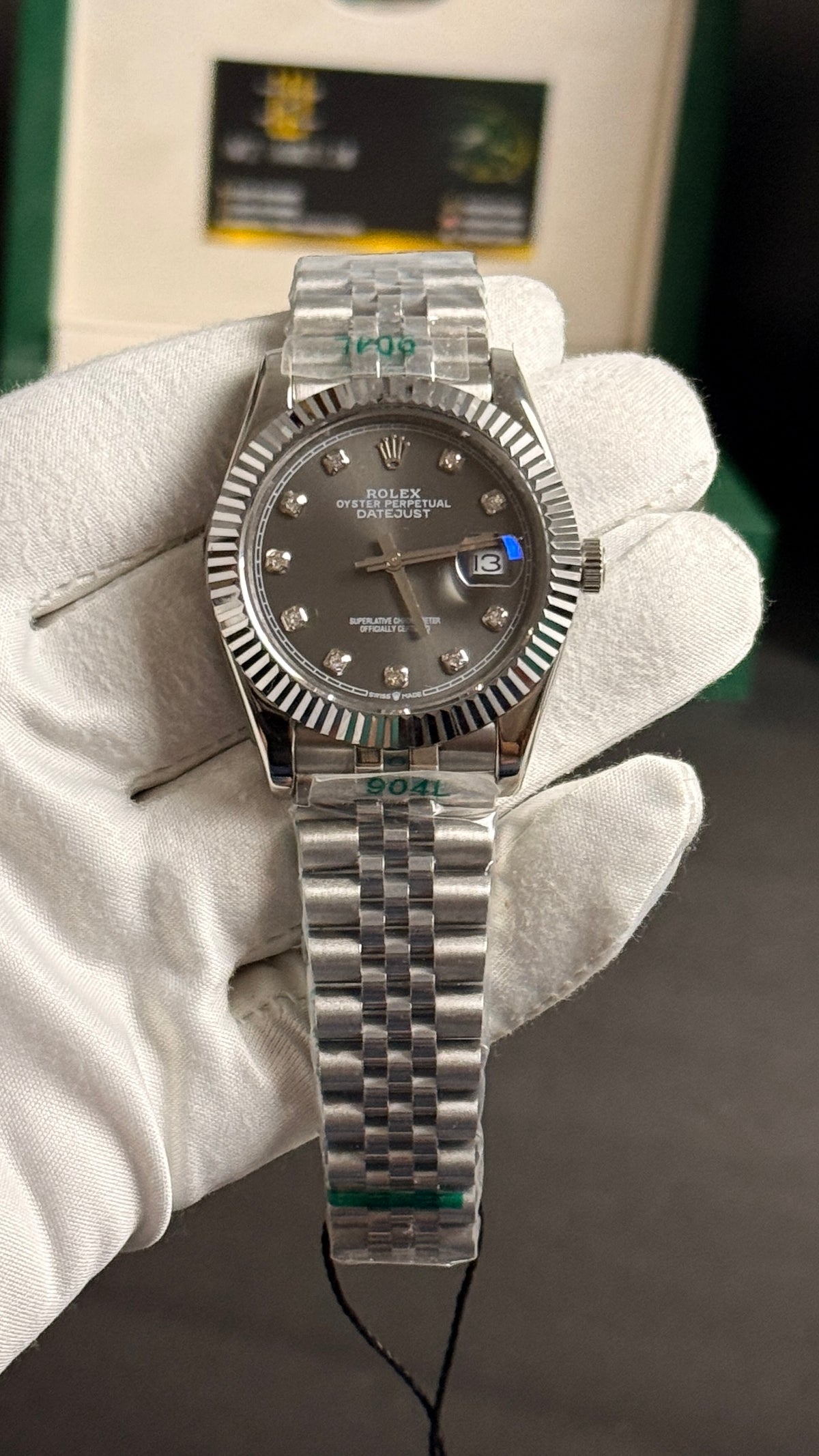 Silver with grey Dial.