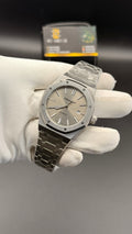 Silver with grey Dial.