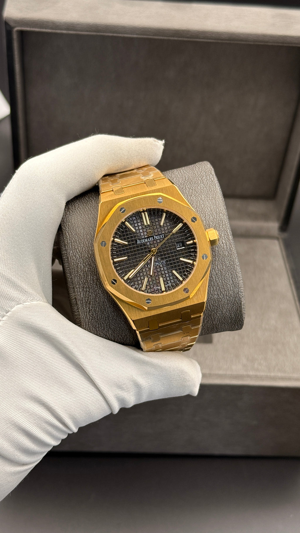 Yellow gold with black Dial.