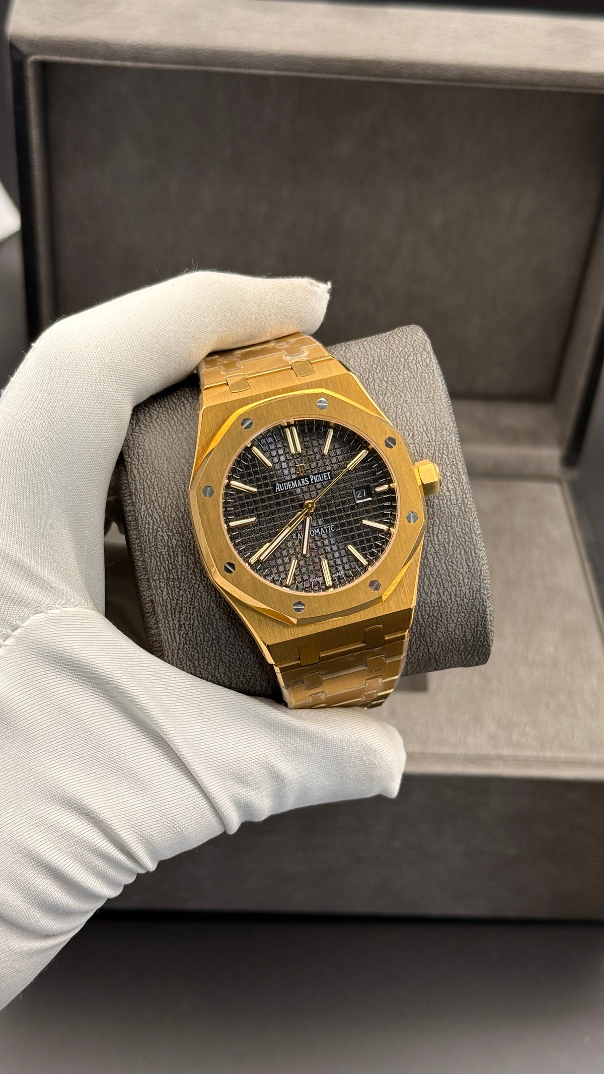 Yellow gold with black Dial.