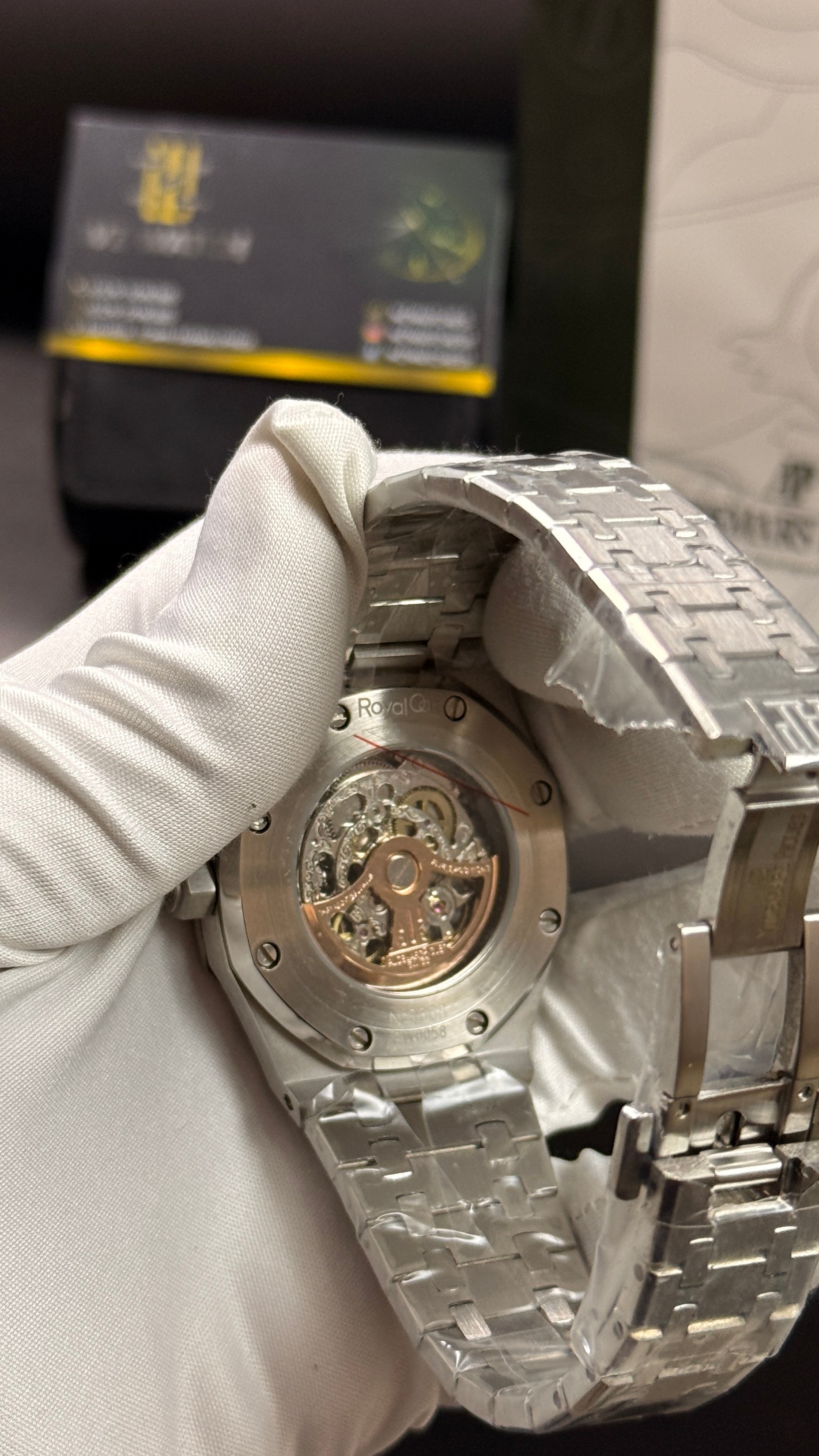 Silver with black skeleton dial