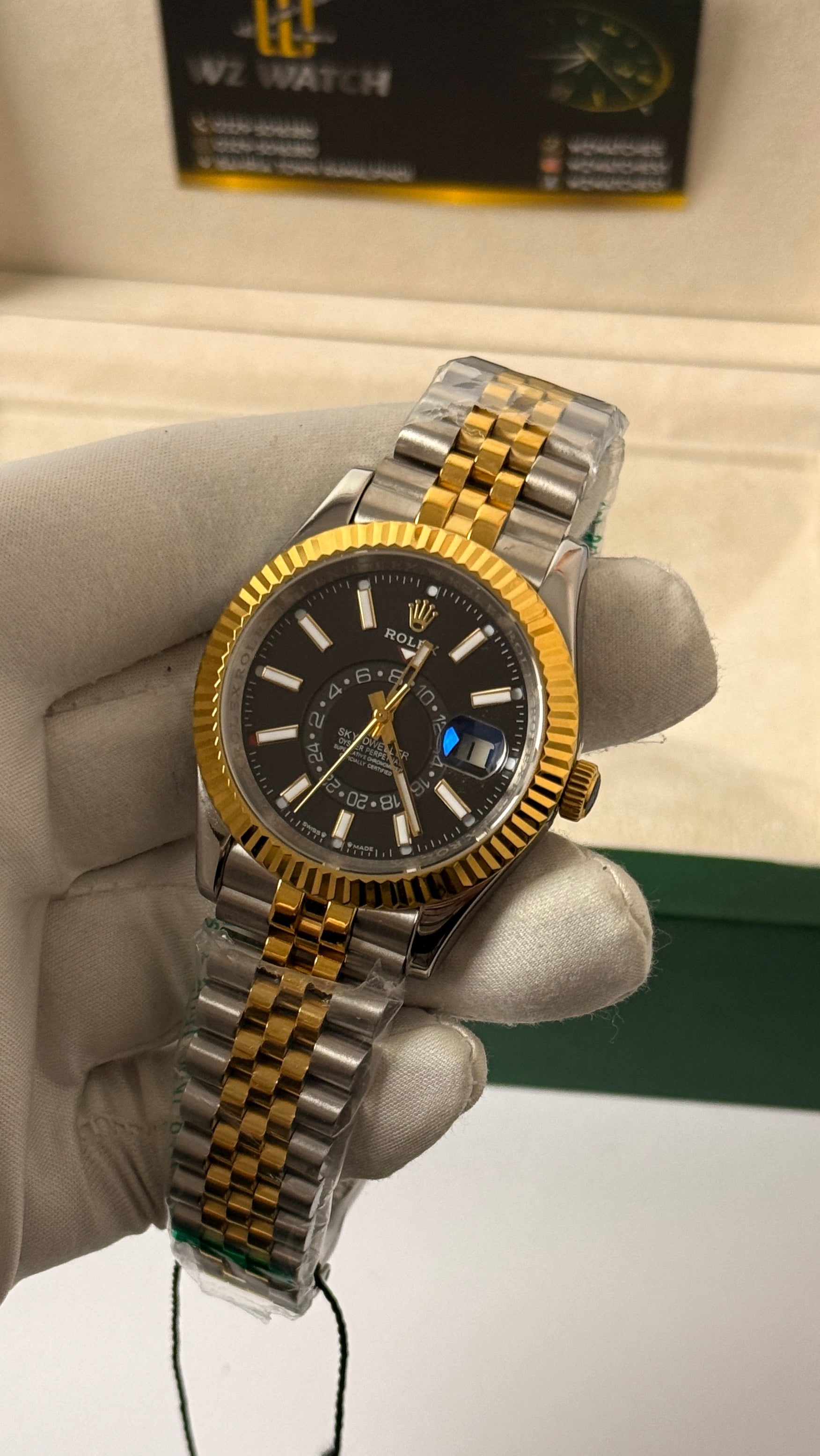 Yellow gold two tone with black Dial