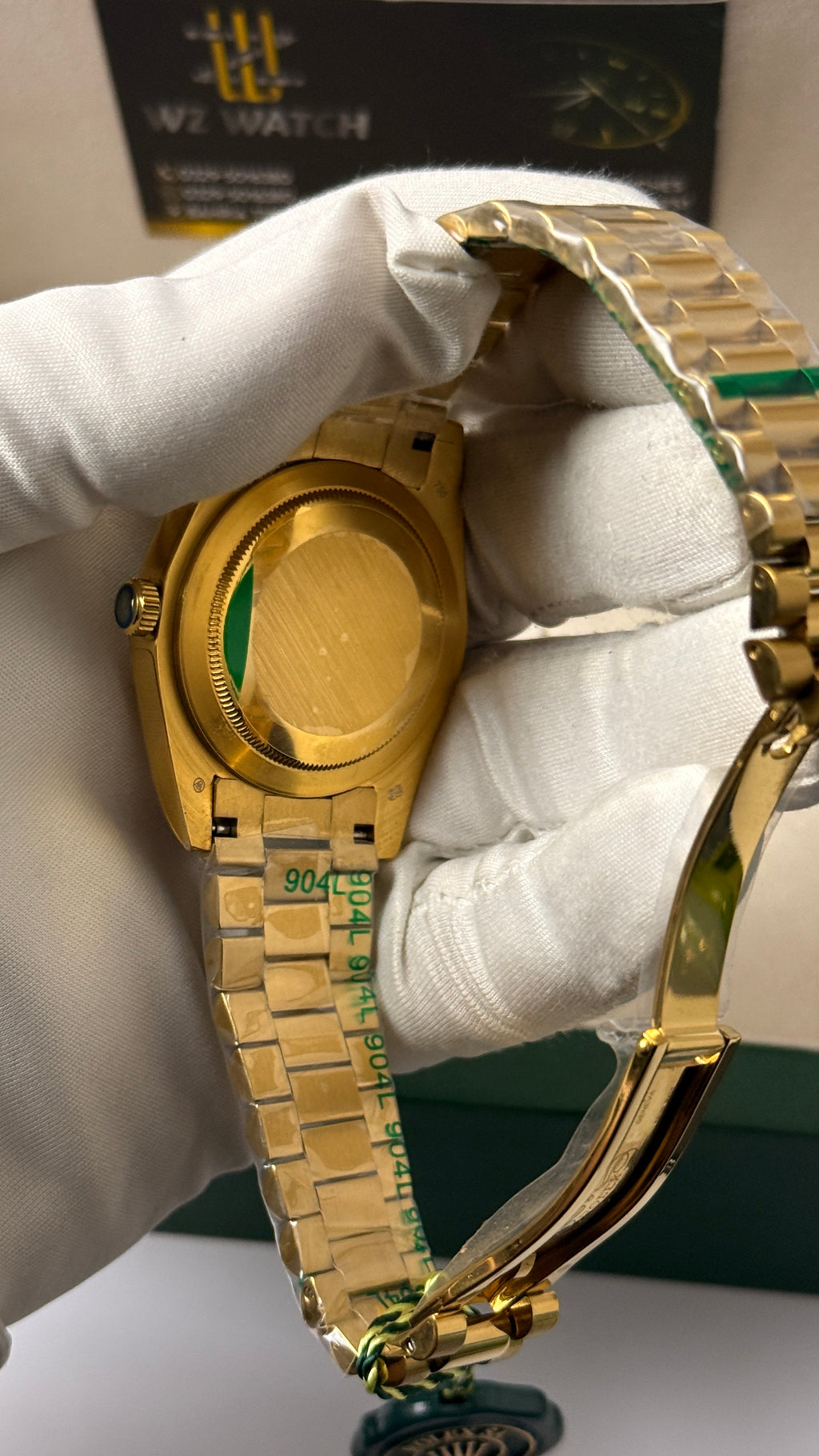 Yellow Gold with green Dial.