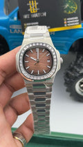 Silver with chocolate Dial.