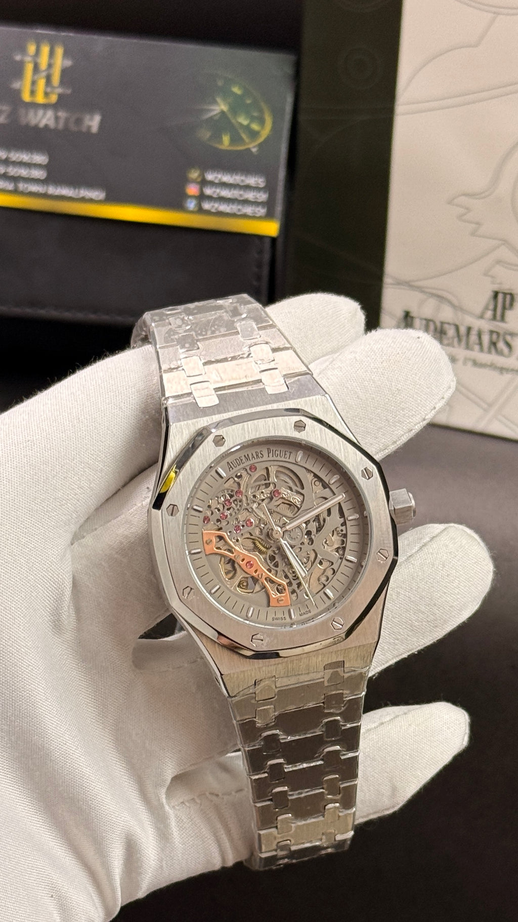 Silver with white skeleton dial