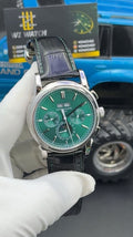 Silver with green Dial.