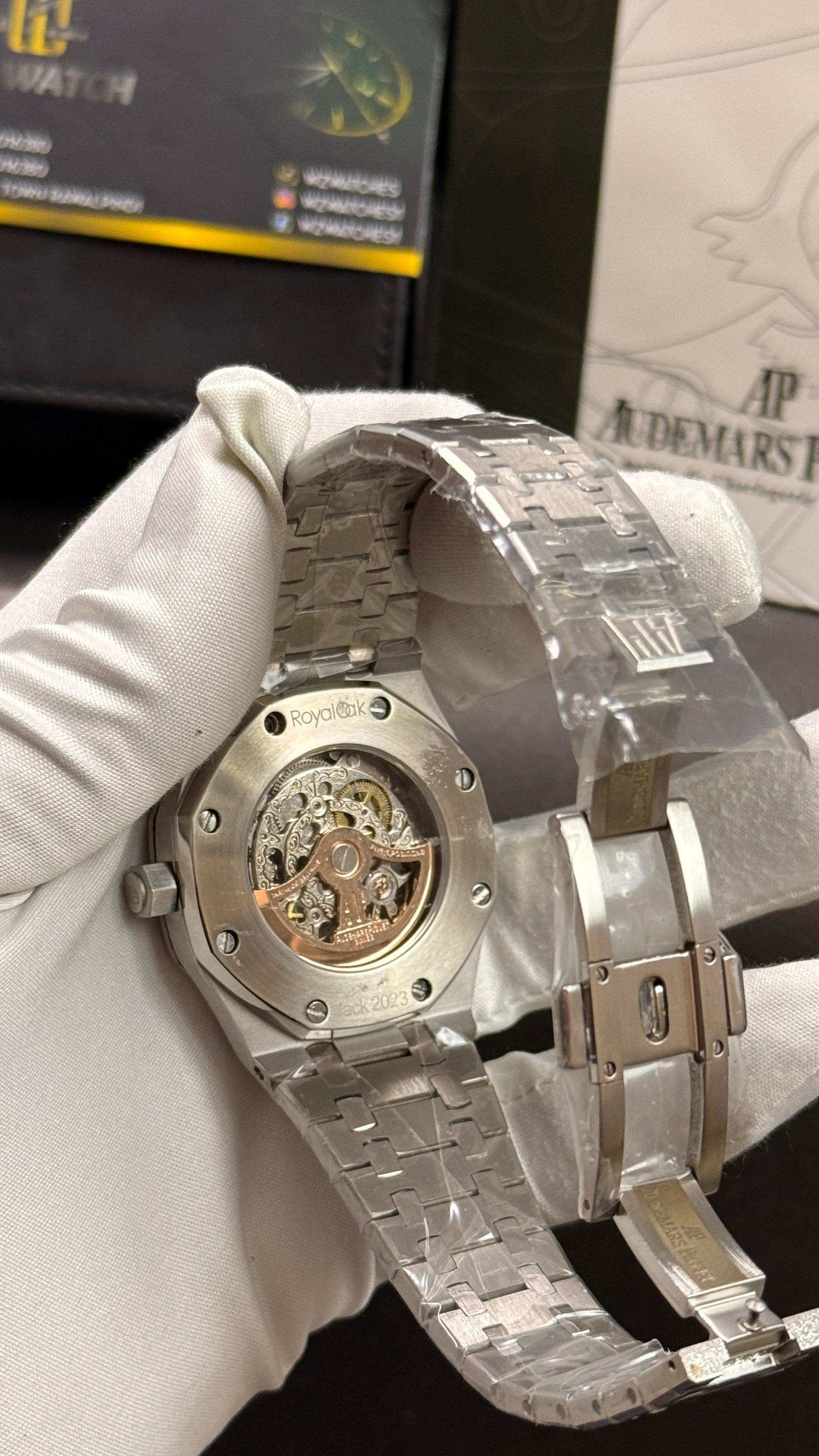 Silver with white skeleton dial