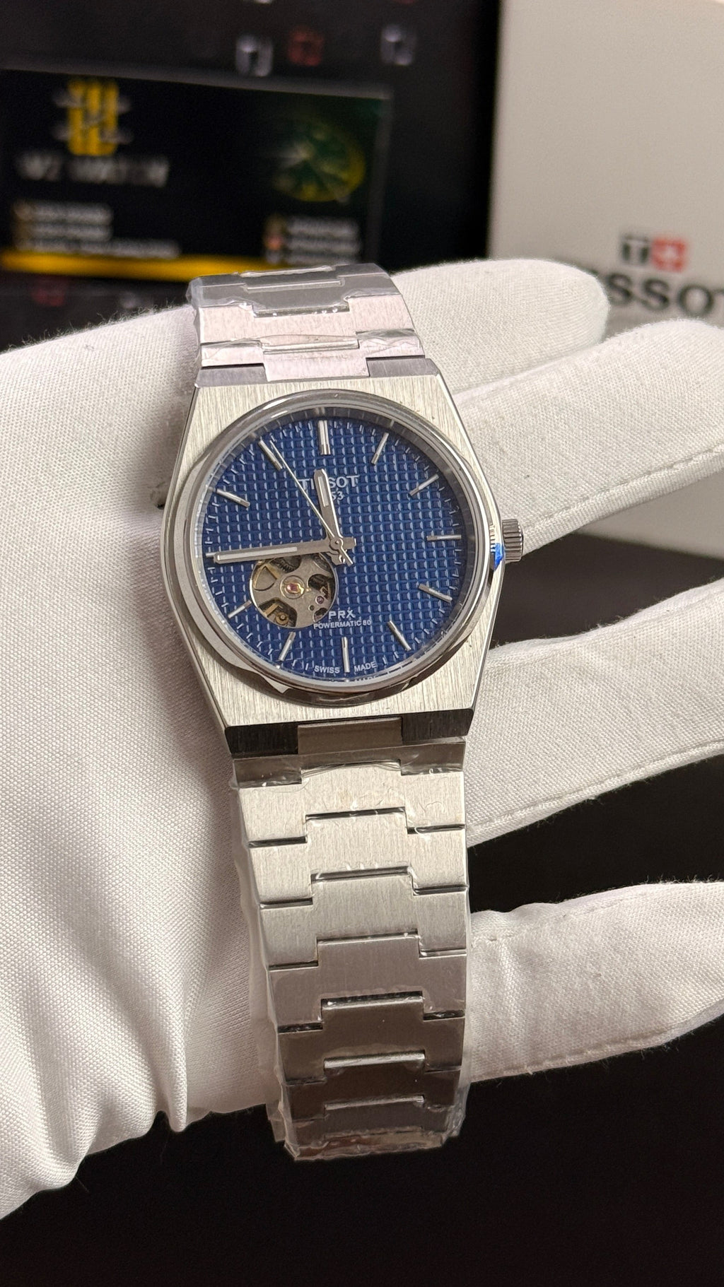 Silver with blue dial