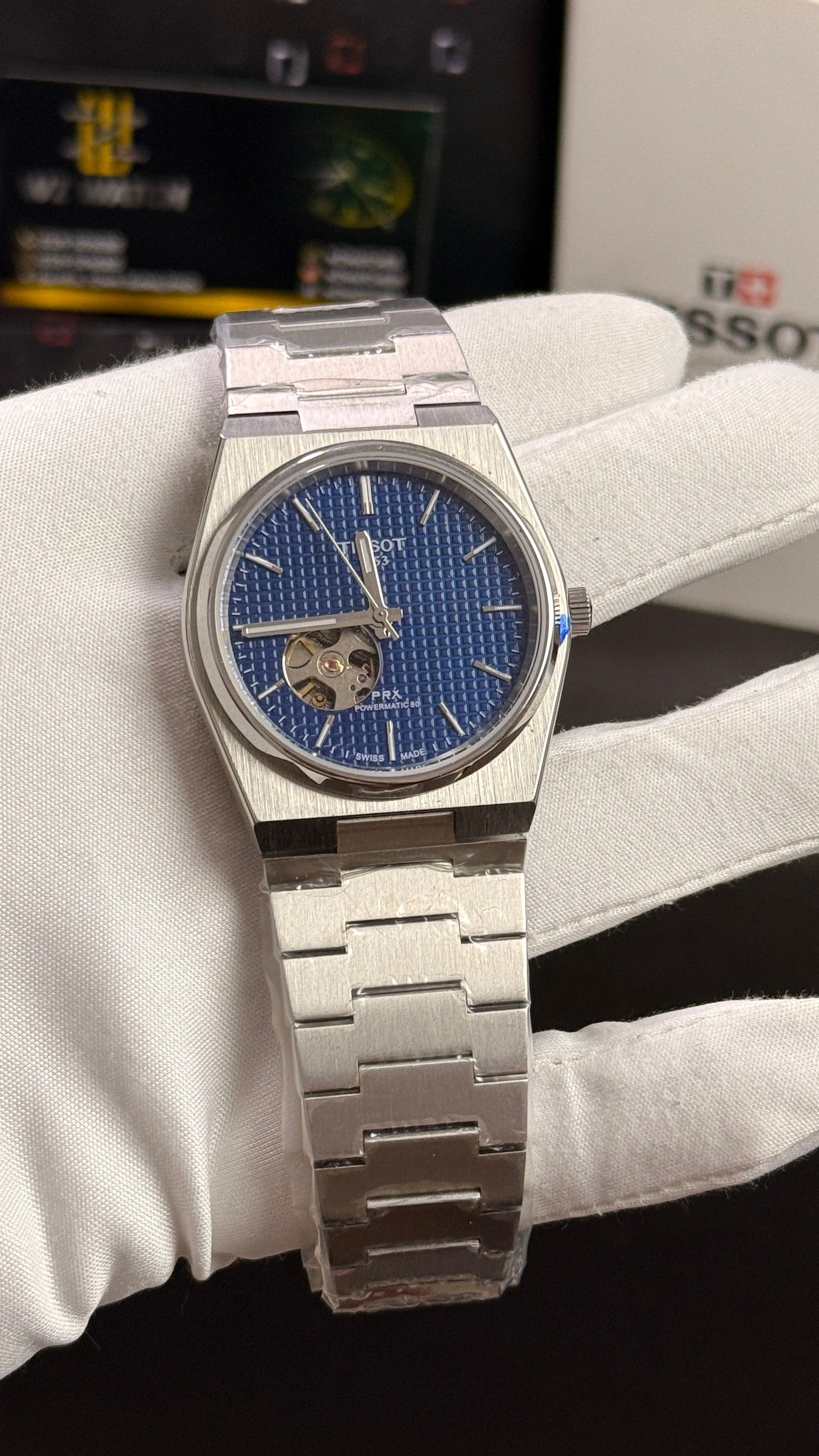 Silver with blue dial