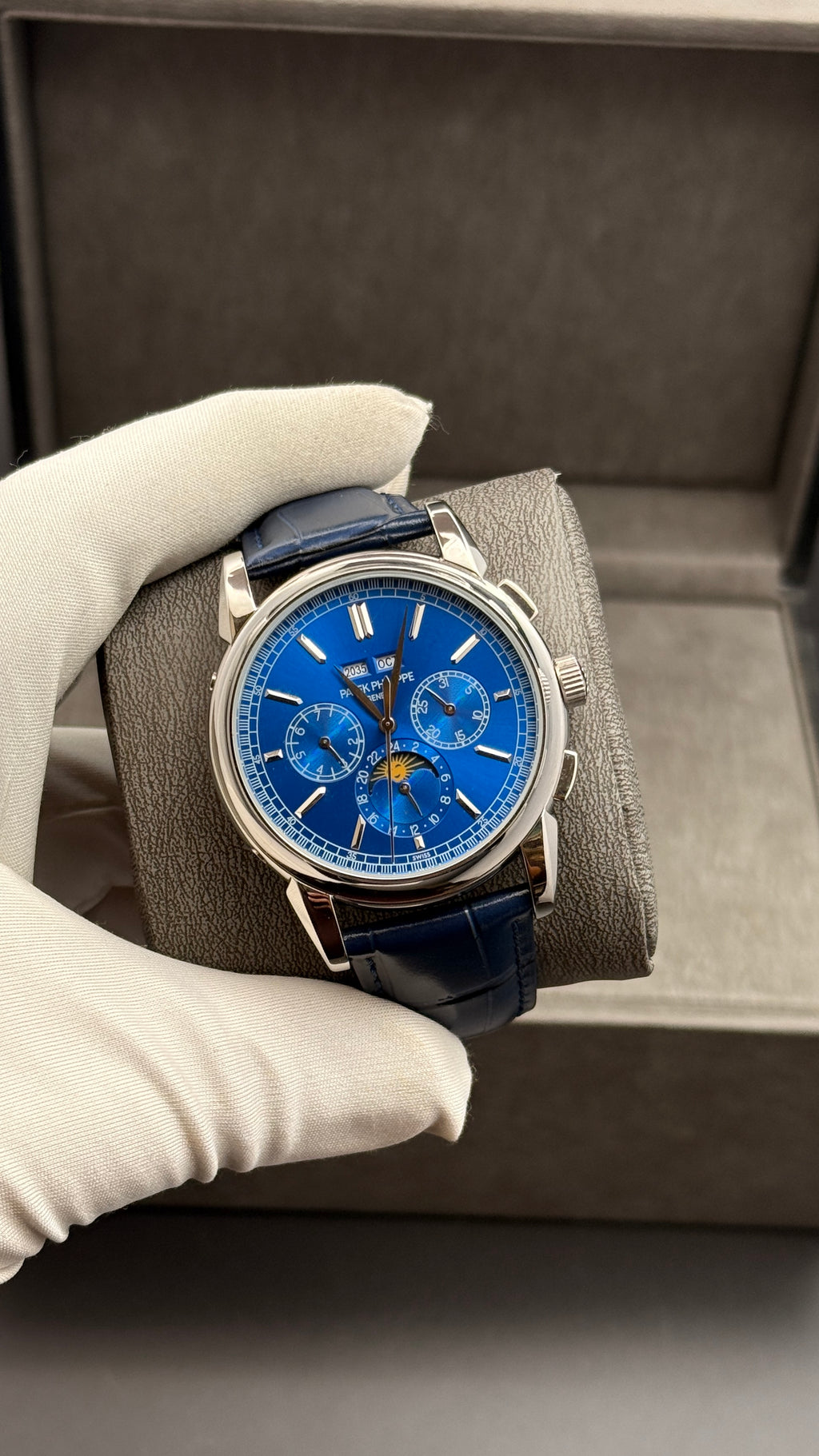 Silver with blue Dial.